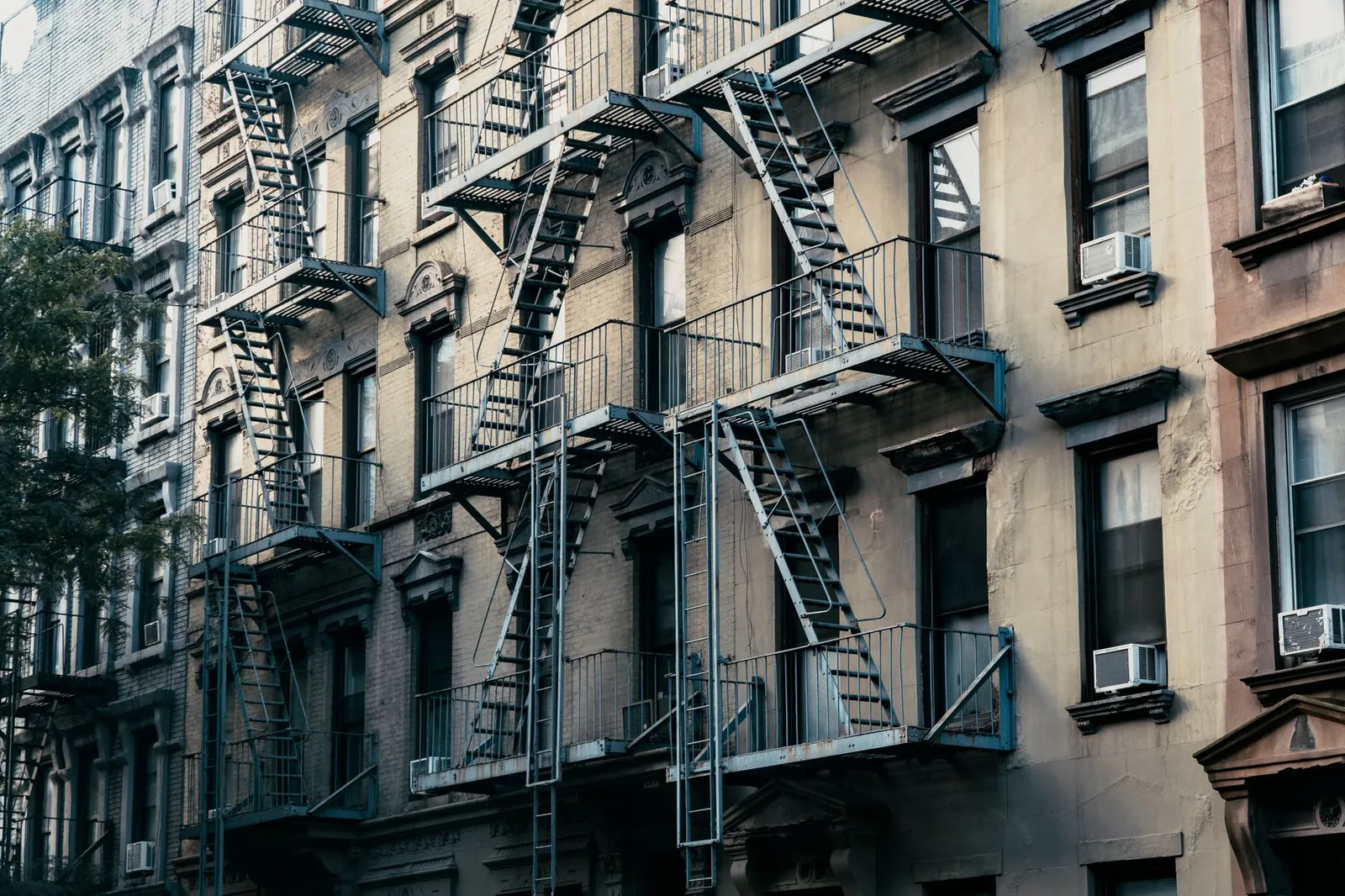 Classic New York City apartment buildings with fire escapes