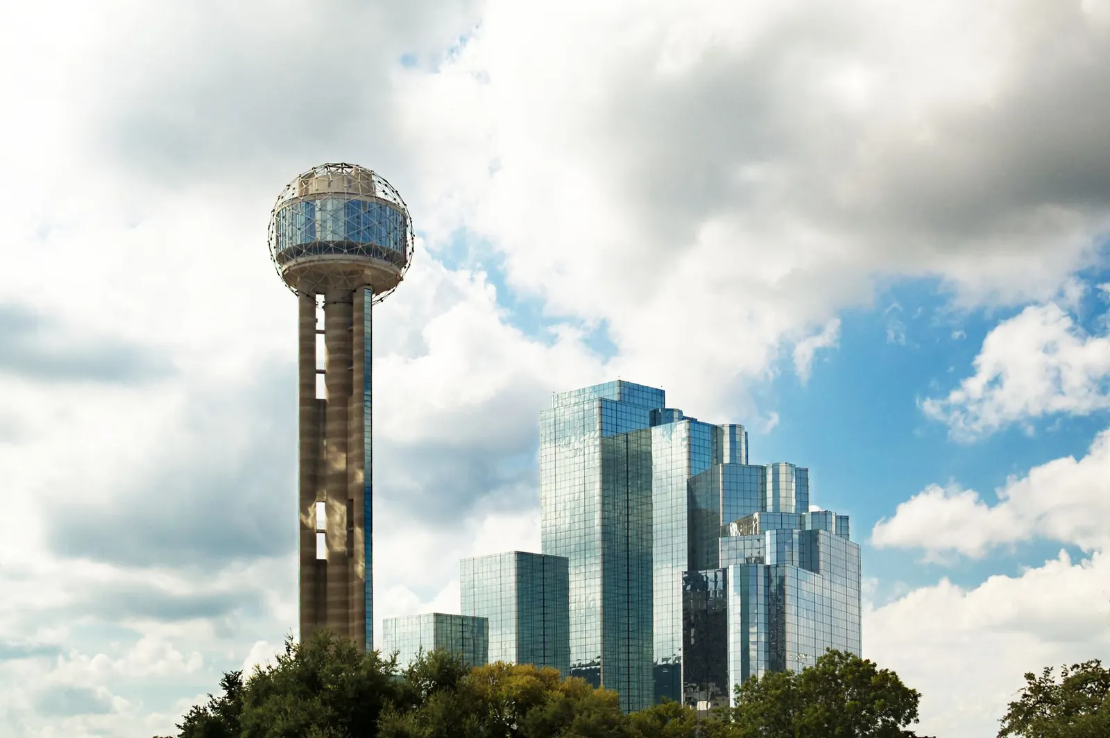Dallas skyline with Reunion Tower under a cloudy sky